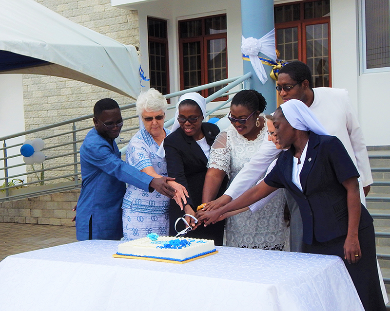 Cutting of the cake at the dedication celebration. 