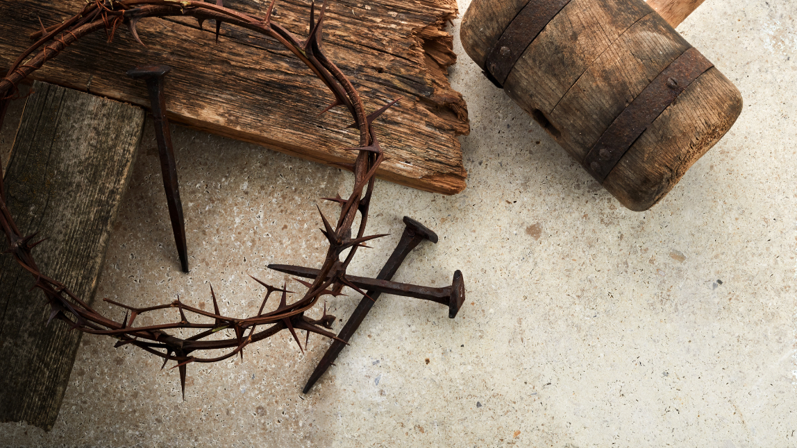 Crucifixion of Jesus Christ. Cross with three nails and crown of thorns on ground. 