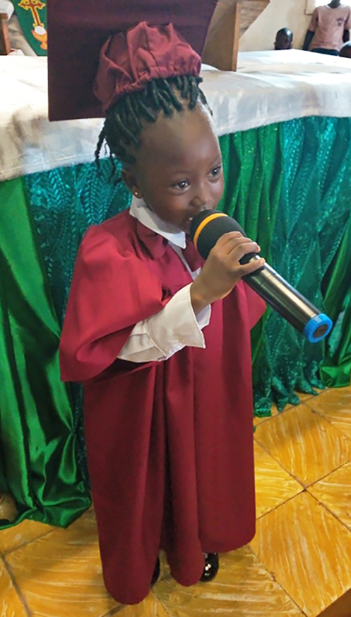 St. Josephs Preschool: a pupil addressing the congregation