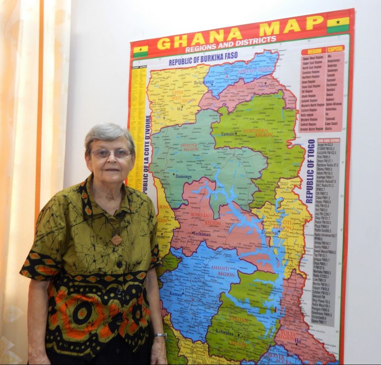 Sister Ann Coleman in front of Ghana map